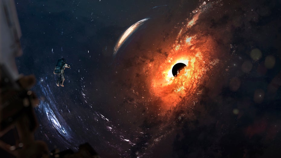 Ein Astronaut schwebt auf die 2019 entdeckte Riesengalerie M87 zu. (Bild: Shutterstock.com / Vadim Sadovsky)